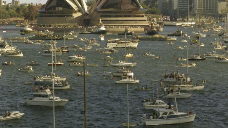 The Fifth Facade: Sydney Harbour boats The Sydney Opera House and Sydney skyline as seen on the day of the Sydney Opera House's opening. Pleasure craft dot the harbour.