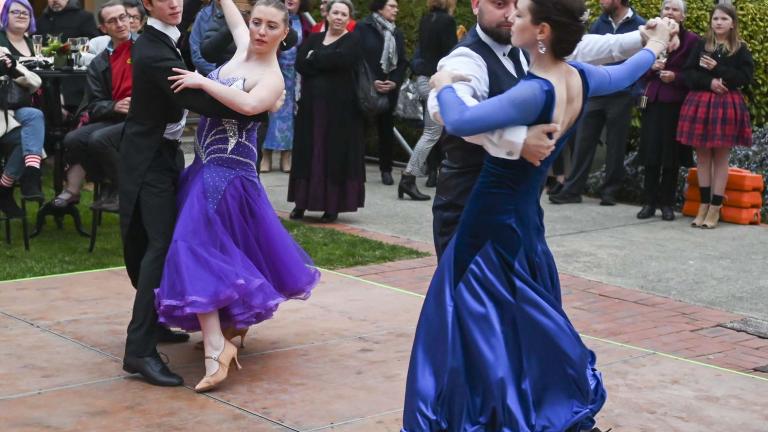 Two couples ballroom dancing in the NFSA courtyard