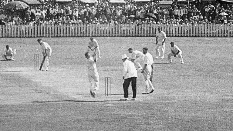 Cricket players and an umpire on the Sydney Cricket Ground playing cricket in 1933.