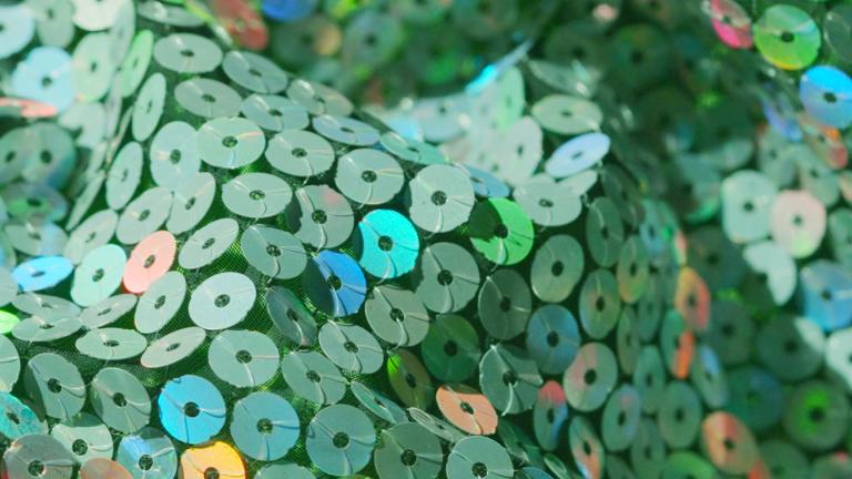 Close up of some green sequinned fabric.