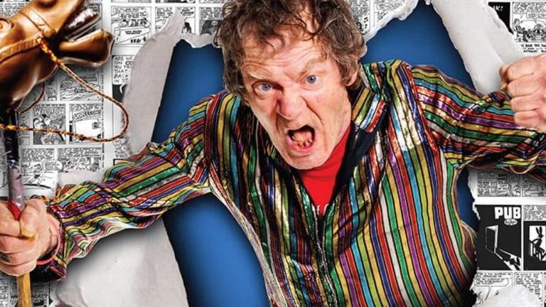 An angry man bursting through a poster making fists with his hands. In one hand he is gripping a toy horse.