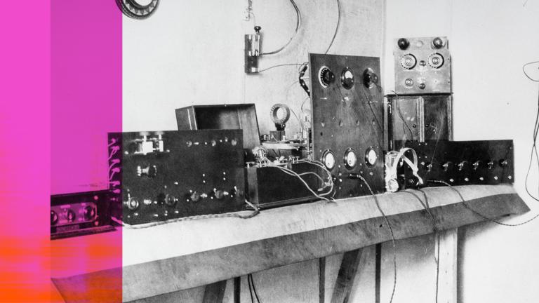A bank of early radio equipment from the 1920s arrayed on a table