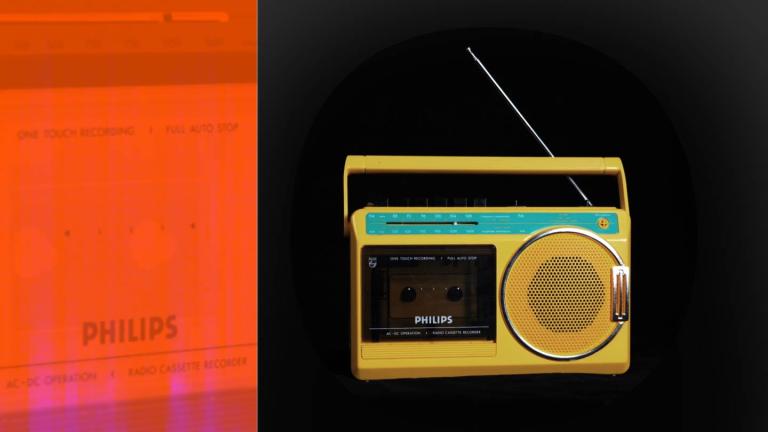 A bright yellow portable radio and cassette player