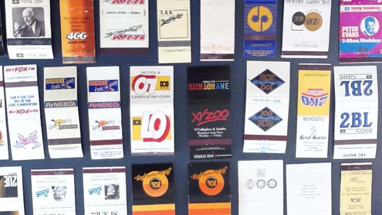 A collection of matchbooks featuring logos from various radio stations