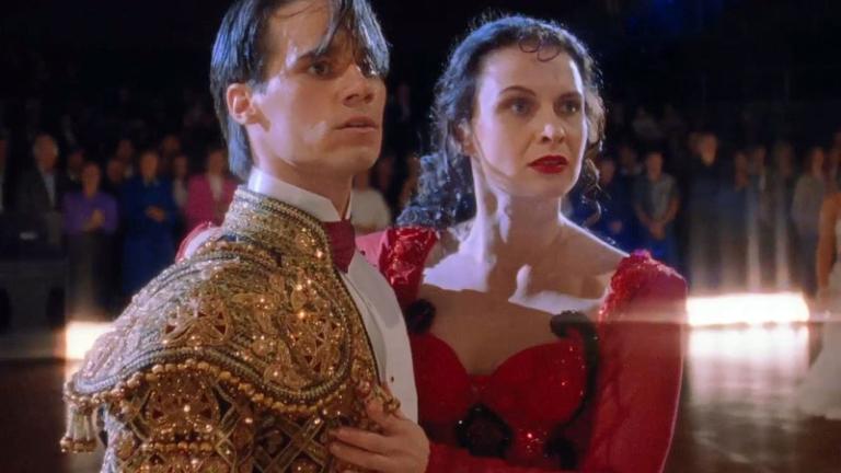 Paul Mercurio and Tara Morice in costume on the dancefloor in a scene from Strictly Ballroom