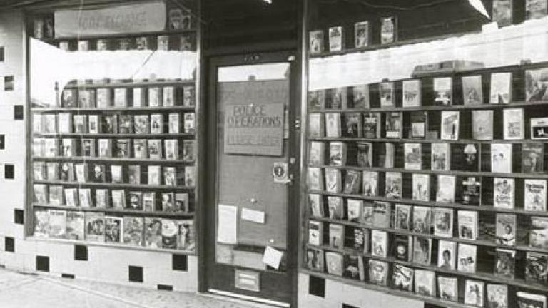 Front of a bookshop with rows of books in the windows.