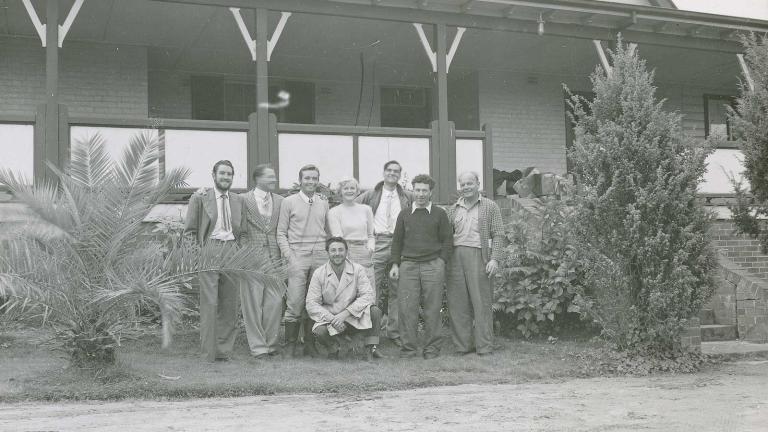 A group shot of cast and crew from the 1951 film Captain Thunderbolt posing in front of a homestead verandah