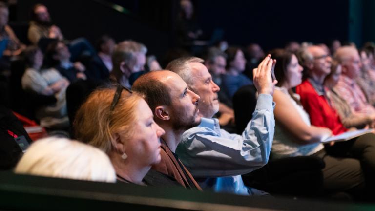 Audience watching a conference