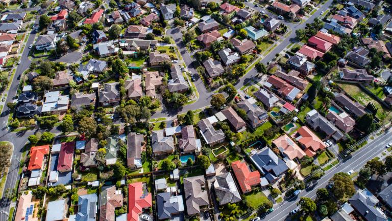 Aerial shot of houses in the outer suburbs of Melbourne.