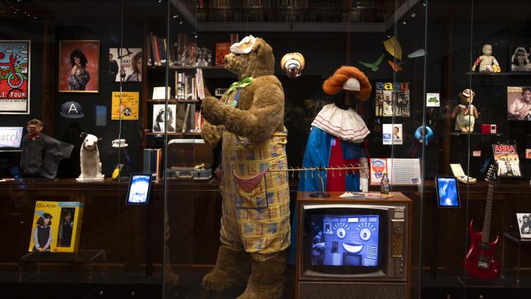 The costumes for children's TV characters Fredd the Bear and Bobo the Clown on display in a glass case at the NFSA.