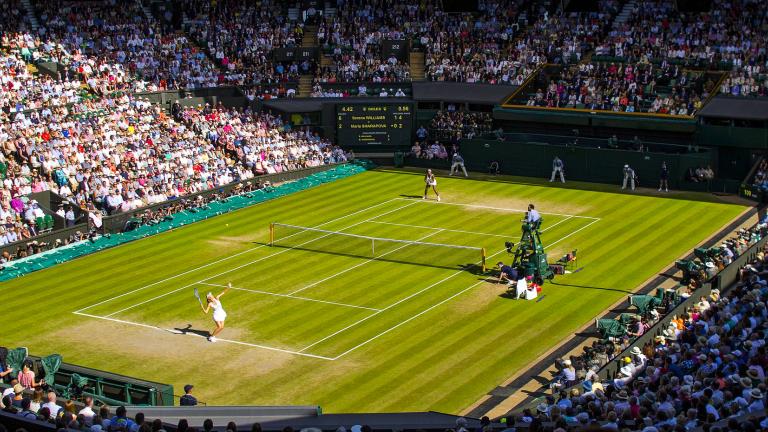 A tennis championship singles match taking place at Wimbledon