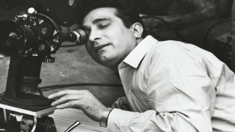 Giorgio Mangiamele looking into a movie camera, circa 1950s