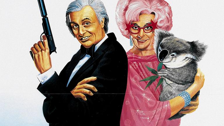 An illustration of Barry Humphries as both Les Patterson and Dame Edna Everage. They stand back to back. Les holds a gun with silencer. Edna holds a koala. Her hair is pink. She wears pink sparkly glasses.