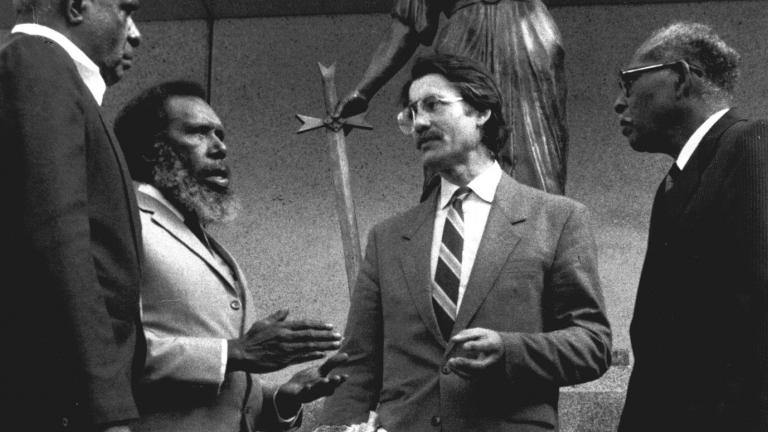 Eddie Mabo junior, Eddie Mabo and Greg McIntyre being interviewed on Murray Island. There is a boom in shot.