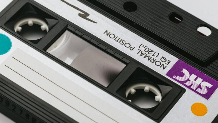 Close-up of a cassette tape with a blank label
