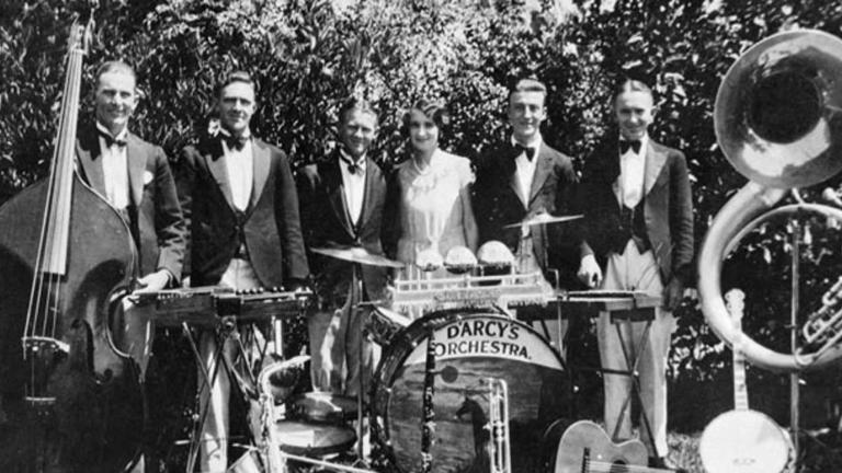 The six members of jazz dance band Doreen D’Arcy’s Orchestra pose with their instruments in 1931