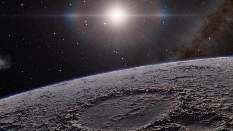 The surface of the Moon with the Sun visible in the background