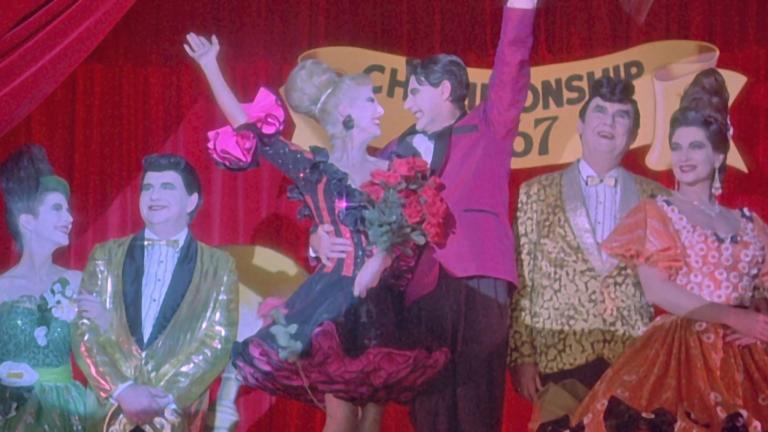 Strictly Ballroom flashback scene three couples dressed overly garishly in ballroom dancing costumes