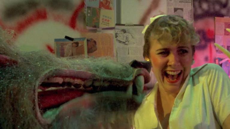 Film still from Howling III: The Marsupials showing girl being attacked by werewolves