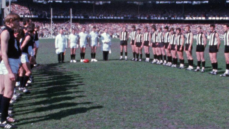 Carlton and Collingwood VFL teams line up on the MCG before the 1970 grand final match.