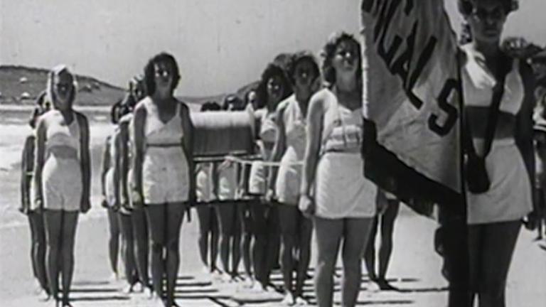 Female lifesavers from Terrigal Surf Life Saving Club participate in a march past