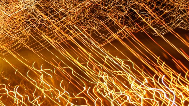 A long exposure image of lights. They have left trails across the image.