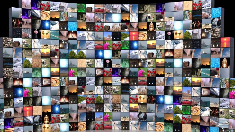 A bank of TV screens showing diverse colourful images