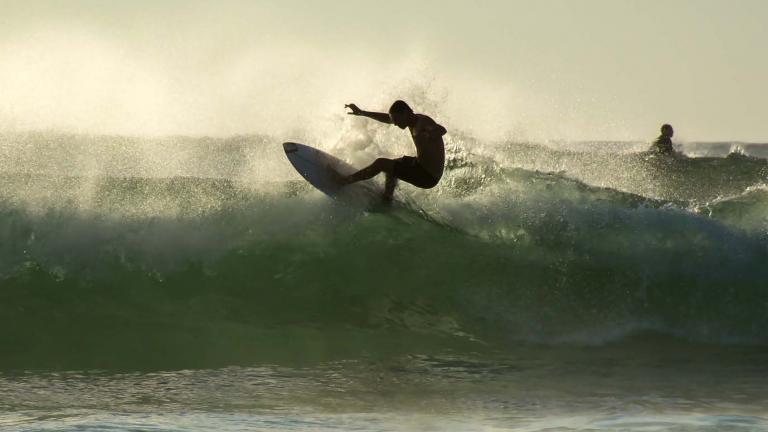 Young surfer surfing at Bondi Beach