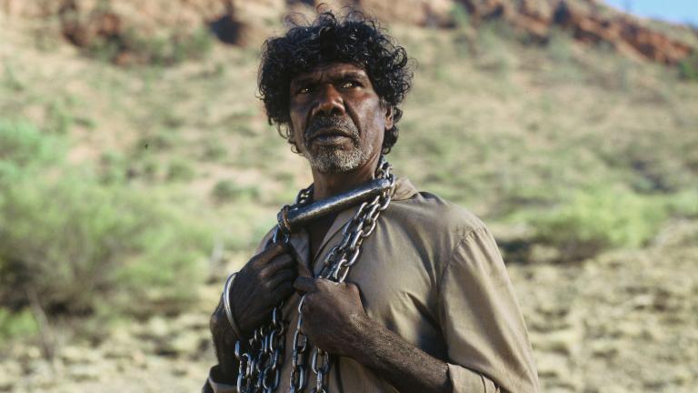 David Gulpilil as The Tracker in a scene from the 2002 film The Tracker David Gulpilil as The Tracker, with a chain around his neck, in a scene from the 2002 film The Tracker