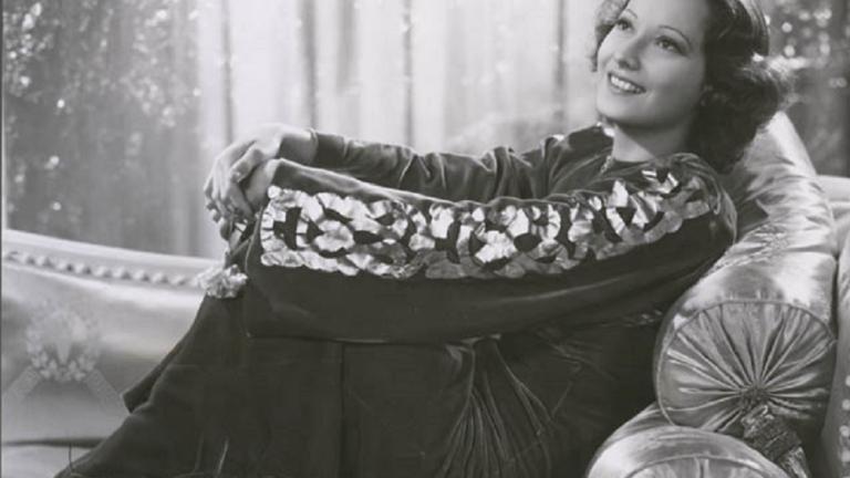 Merle Oberon reclining on a chaise lounge Publicity portrait of Merle Oberon reclining on a chaise lounge