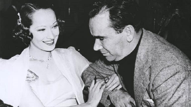 Merle Oberon and William K Howard Merle Oberon linking arms with William K Howard.