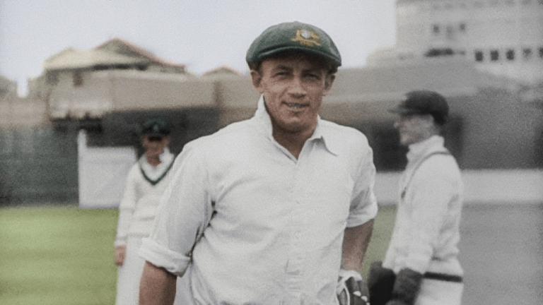 Colourised film still of Donald Bradman walking off the cricket pitch. Colourised film still of Donald Bradman walking off the cricket pitch.
