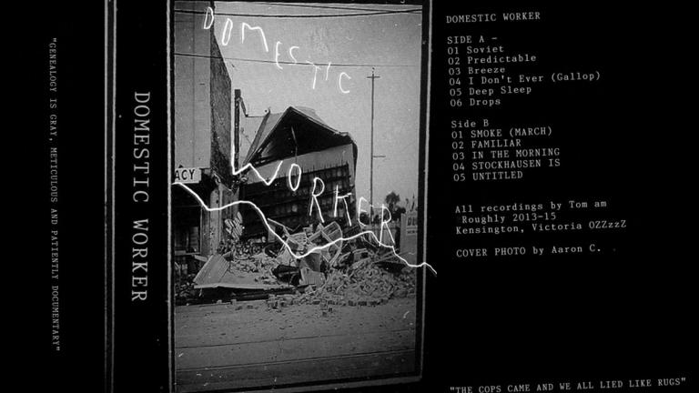 Cassette cover featuring a partly destroyed building. Text reads: Domestic Worker. Cassette cover featuring a partly destroyed building. Text reads: Domestic Worker.