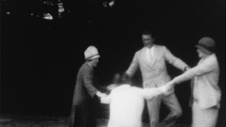 Frame capture of Melba dancing with her son, George, daughter-in-law, Evie, and her grand daughter, Pamela