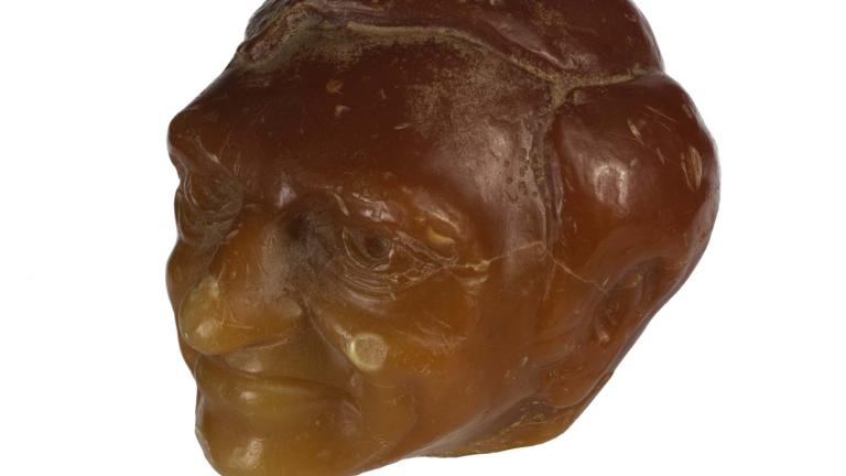 Sculpted orange wax candle of Graham Kennedy's head. Sculpted orange wax candle of Graham Kennedy's head.