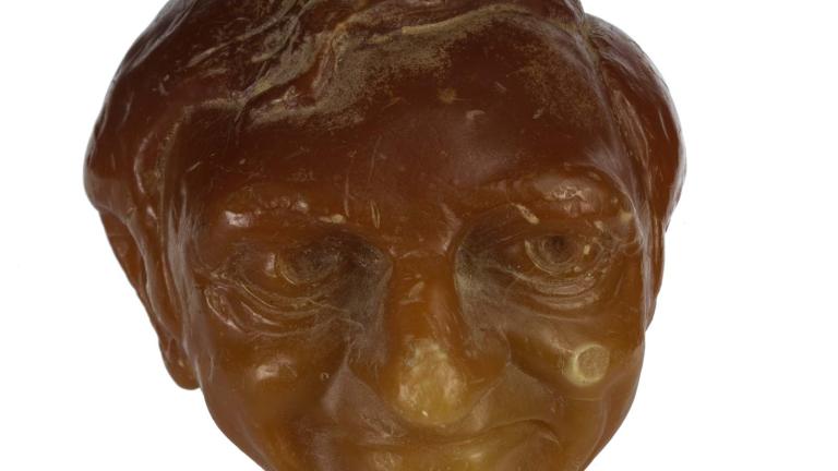 Sculpted orange wax candle of Graham Kennedy's head. Sculpted orange wax candle of Graham Kennedy's head.