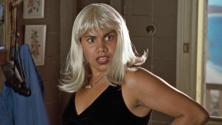 A young Aboriginal woman wearing a blonde wig