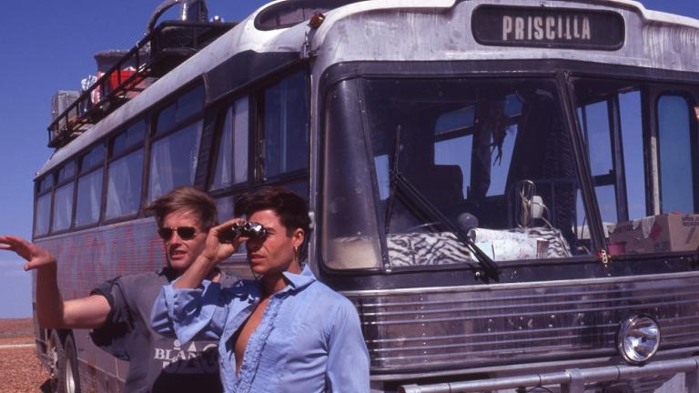 Director Stephan Elliot and Guy Pearce look out across the stony gibber desert with the bus in the background. Director Stephan Elliot and Guy Pearce look out across the stony gibber desert with the bus in the background.