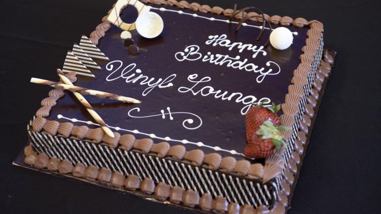 Vinyl Lounge birthday cake Chocolate cake with icing that says 'Happy birthday Vinyl Lounge'