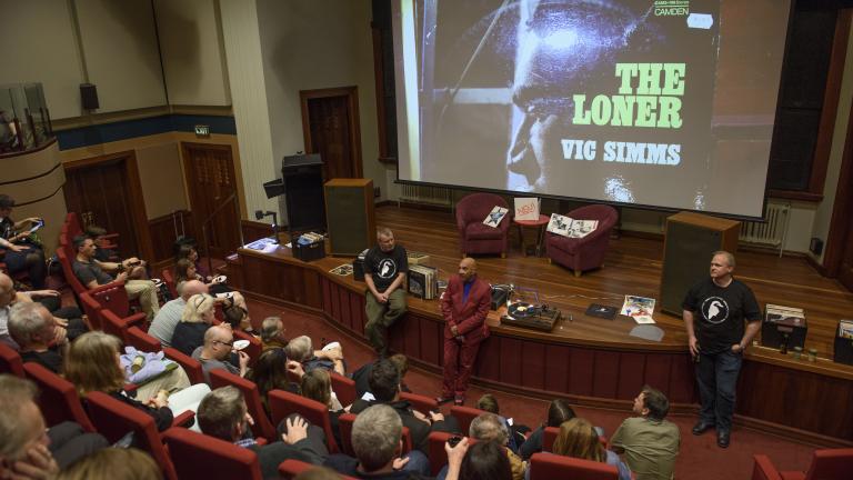 Vic Simms talks to the crowd about his record The Loner Vic Simms talks to the crowd about his record The Loner
