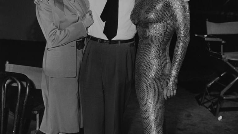 Annette Kellerman on the set of Million Dollar Mermaid with Esther William wearing a gold sequined unitard. 