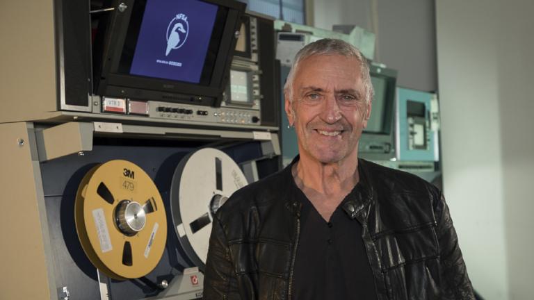 John Waters at the NFSA, with video equipment in the background