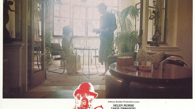 Caddie lobby card with Helen Morse as Caddie and Takis Emmanuel as Peter at an occasional table with the sun streaming through a bay window.
