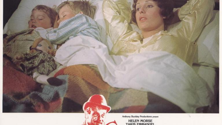 Caddie lobby card woth Helen Morse as Caddie in bed looking pensive with her two on screen children sleeping besdie her