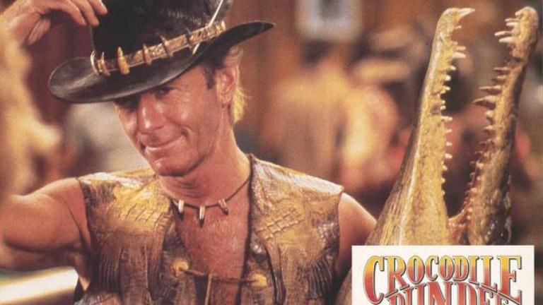 Mick and his buddy Lobby card showing Paul Hogan as Mick 'Crocodile' Dundee holding a taxidermied crocodile