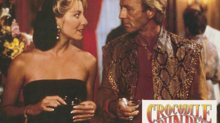 Crocodile Dundee German lobby card 7 Lobby card depicting Linda Kozlowski as Sue Charlton and Paul Hogan as Mick Dundee looking into each other's eyes