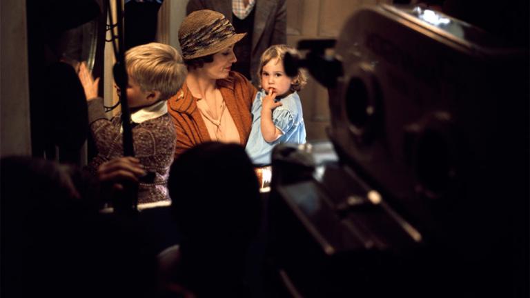 Bewhind the scenes photo with the film crew and of Helen Morse with her on-screen children played by Deborah Kounnas and Simon Hinton. Morse is holding Kounnas.