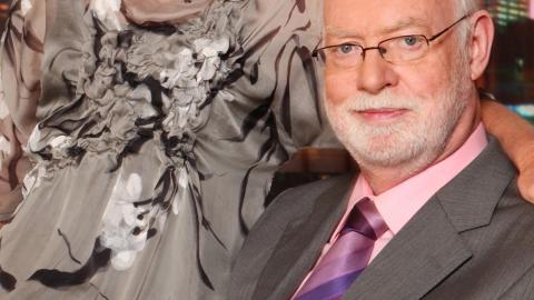 Film critic and author David Stratton seated