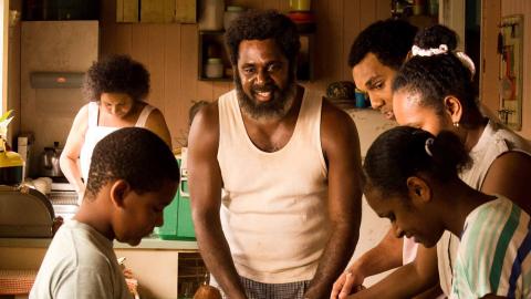 A family at home in their kitchen in a scene from the film Mabo.