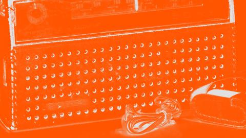 Close crop image of old radio with orange filter